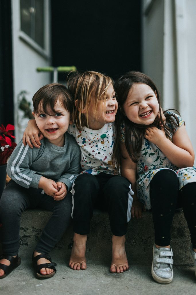 Children hugging and smiling