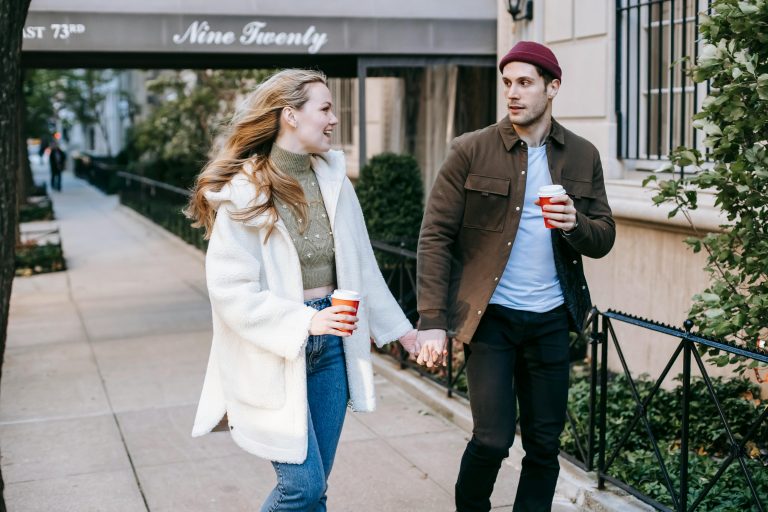 Woman and Man holding hands and talking