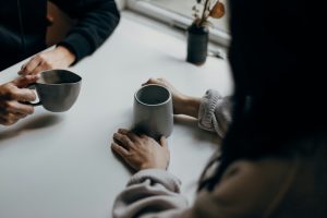 Two people talking and listening to each other.