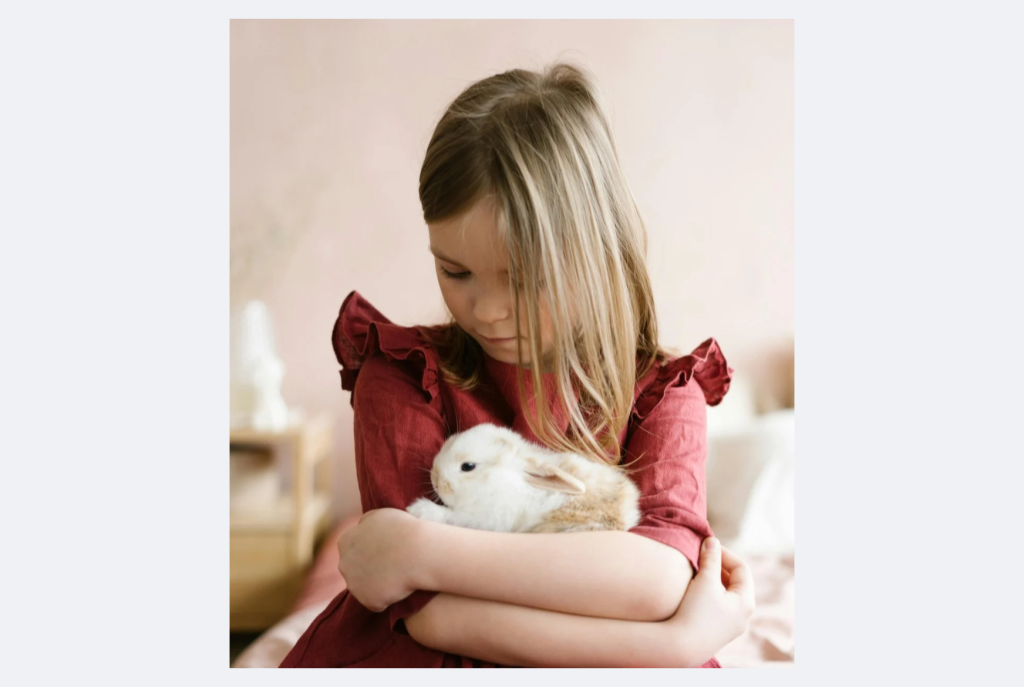 Child hugging bunny